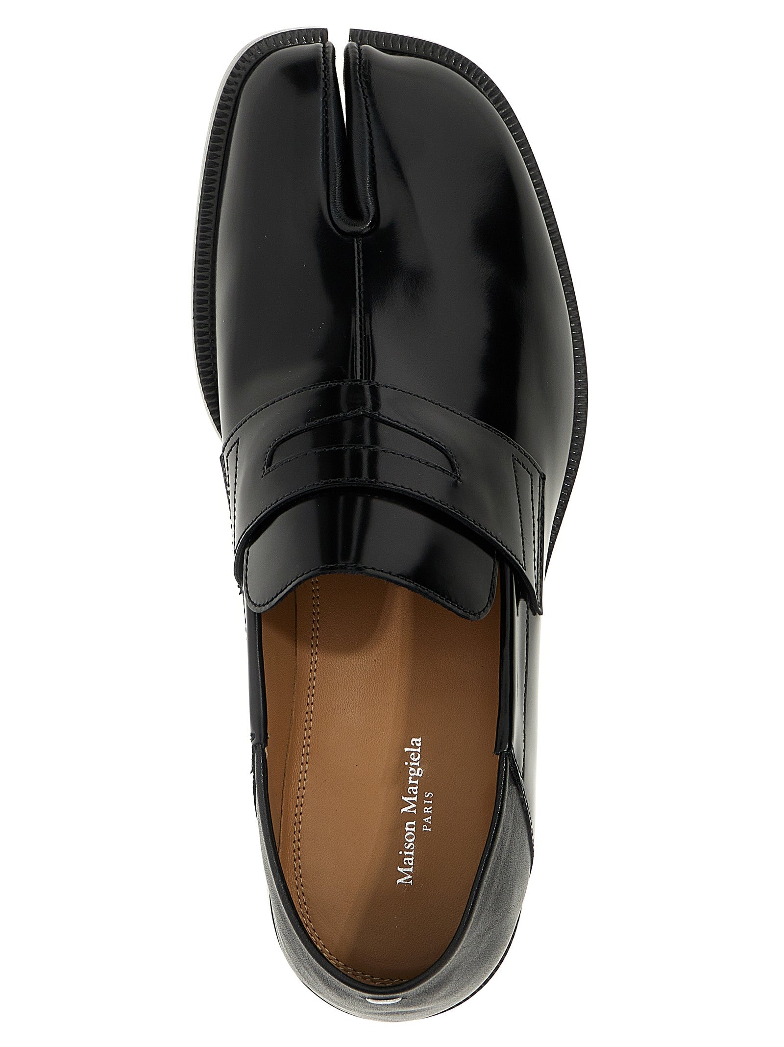 Loafer Slip-On Shoes by Maison Margiela for men in calfskin leather black & signature showcases a timeless silhouette from the Men's Calfskin Leather Loafer Slip-On Shoes collection, featuring a timeless and for a timeless finish.