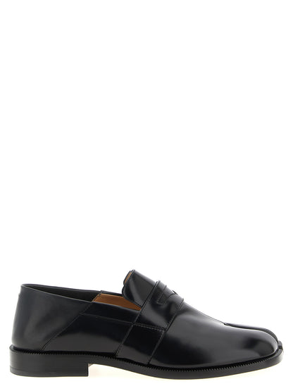 This Flat Loafer Slip-On Sock Shoes by Maison Margiela for women in calfskin leather black features an exquisite silhouette from the Japanese Women's Calfskin Leather Flat Loafer Slip-On Sock Shoes collection, defined by a sophisticated flat and elegant .