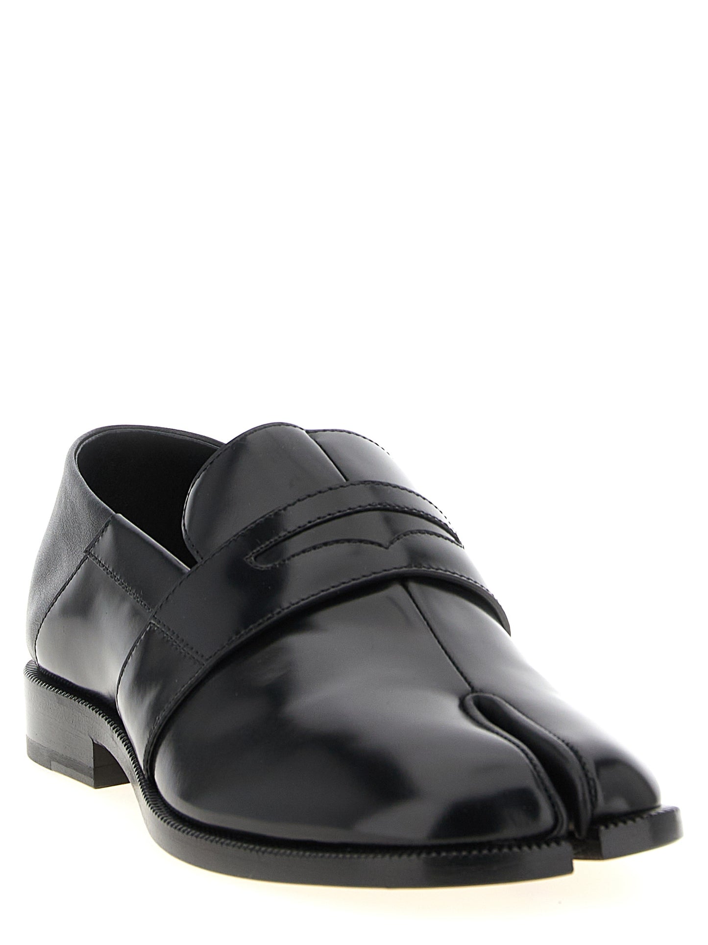 Flat Loafer Slip-On Sock Shoes by Maison Margiela for women in calfskin leather black showcases a resplendent Japanese Women's Calfskin Leather Flat Loafer Slip-On Sock Shoes aesthetic, defined by its resplendent and elegant flat.