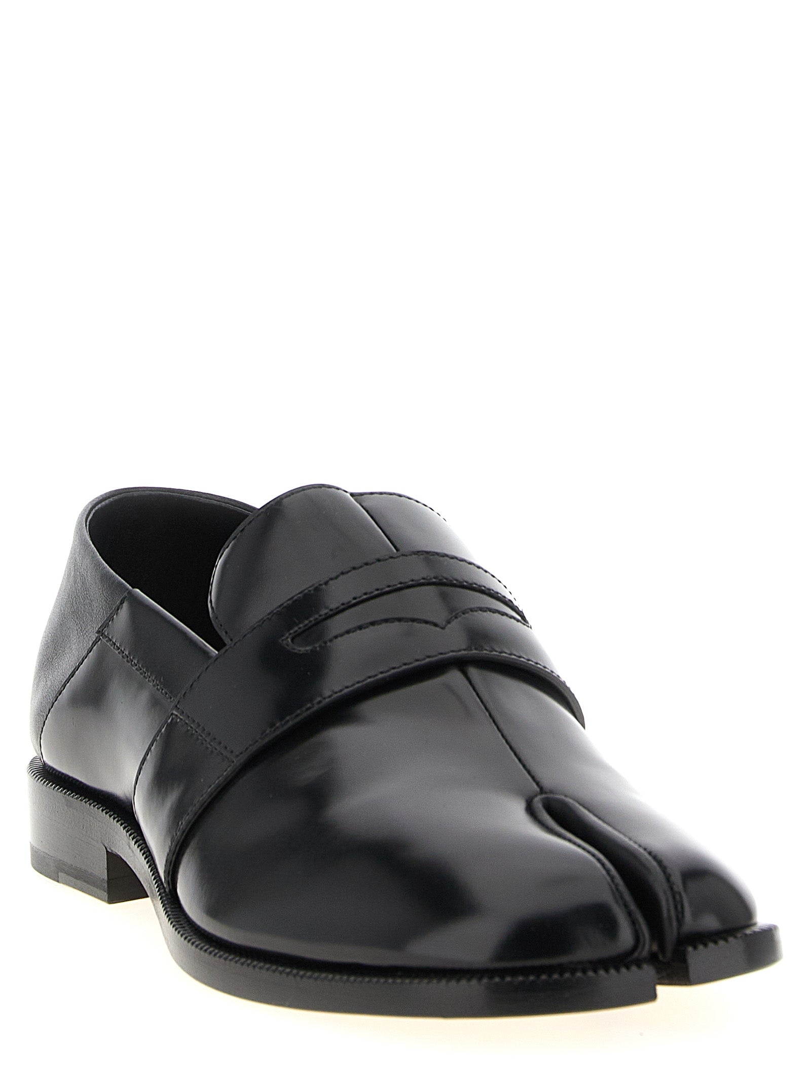 Flat Loafer Slip-On Sock Shoes by Maison Margiela for women in calfskin leather black showcases a resplendent Japanese Women's Calfskin Leather Flat Loafer Slip-On Sock Shoes aesthetic, defined by its resplendent and elegant flat.