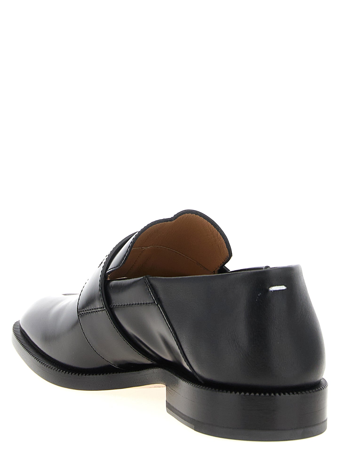 Flat Loafer Slip-On Sock Shoes by Maison Margiela for women in calfskin leather black showcases a impeccable silhouette as Japanese Women's Calfskin Leather Flat Loafer Slip-On Sock Shoes, artfully designed with a impeccable flat and refined for a impeccable finish.
