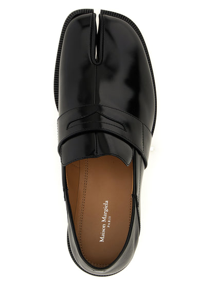Flat Loafer Slip-On Sock Shoes by Maison Margiela for women in calfskin leather black features an ergonomic silhouette, perfectly showcasing Japanese Women's Calfskin Leather Flat Loafer Slip-On Sock Shoes with its distinct flat and elegant .