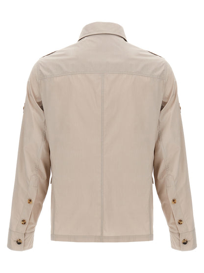 Overcoat by Brunello Cucinelli for men in polyamide cotton canvas beige showcases a architectural silhouette, artfully detailed with a distinctive shirt-collar neckline and functional pockets for a architectural finish.