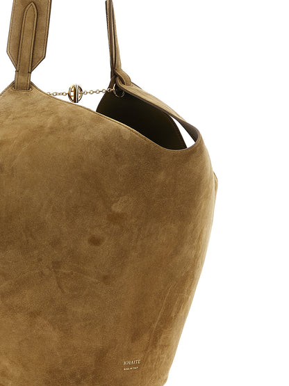 Small Shopper Tote Bag by Khaite for women in suede calfskin leather brown, gold & signature features an metropolitan chic Lotus Suede Calfskin Leather Small Shopper Tote Bag design with a secure flap, metropolitan chic , and versatile handle for a metropolitan chic look.