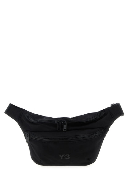 Crossbody Fanny Pack Handbag by Y-3 for unisex in polyamide black features an multi-faceted design with a secure zipper, ample , and versatile crossbody-strap, shoulder-strap & adjustable-strap for a multi-faceted finish.