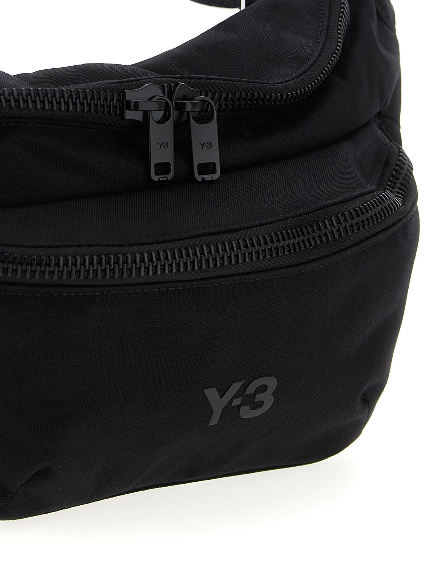 Crossbody Fanny Pack Handbag by Y-3 for unisex in polyamide black features an multi-faceted design with a secure zipper, ample , and versatile crossbody-strap, shoulder-strap & adjustable-strap for a multi-faceted finish.