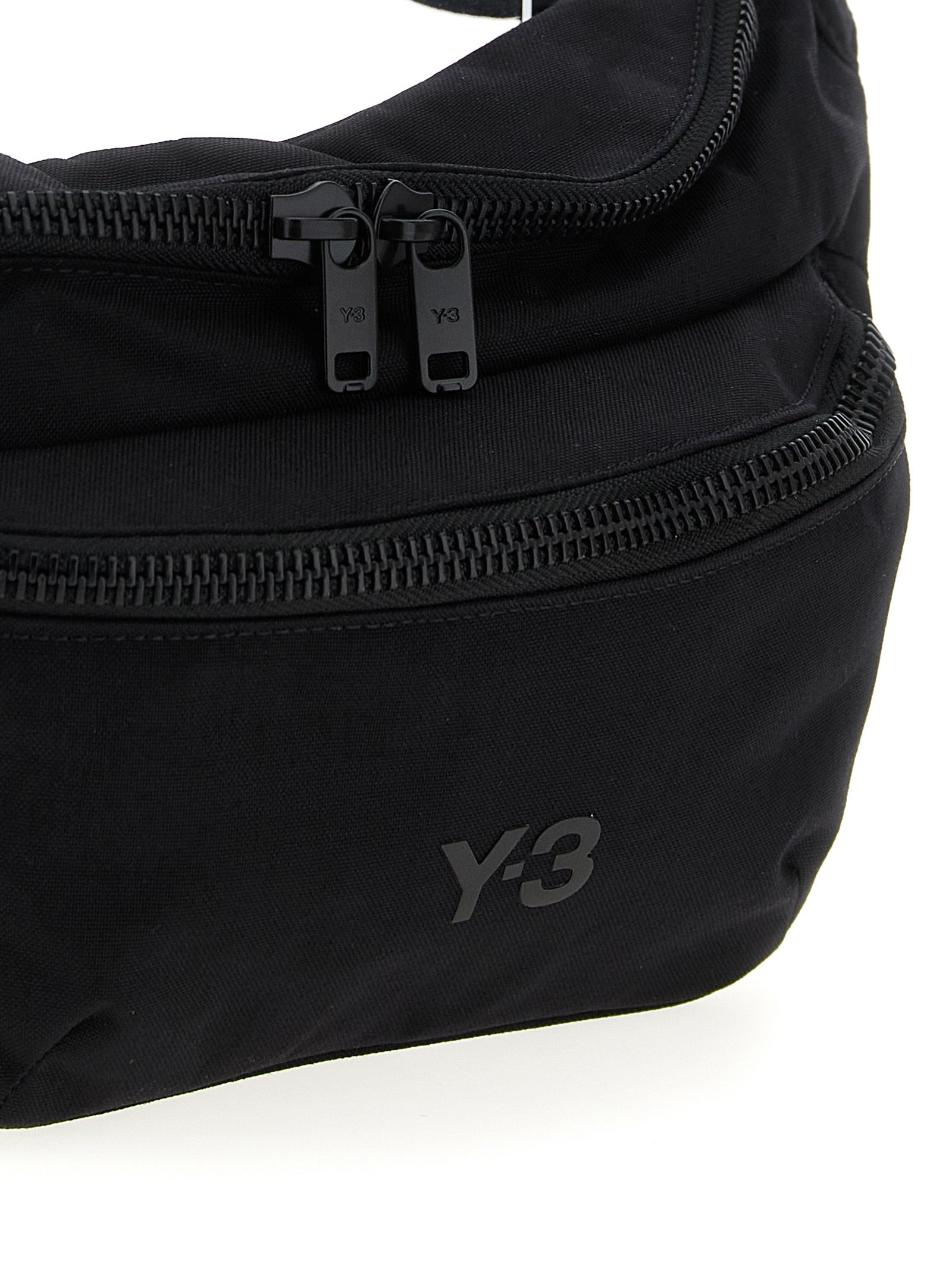 Crossbody Fanny Pack Handbag by Y-3 for unisex in polyamide black features an multi-faceted design with a secure zipper, ample , and versatile crossbody-strap, shoulder-strap & adjustable-strap for a multi-faceted finish.
