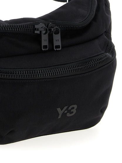 Crossbody Fanny Pack Handbag by Y-3 for unisex in polyamide black features an multi-faceted design with a secure zipper, ample , and versatile crossbody-strap, shoulder-strap & adjustable-strap for a multi-faceted finish.