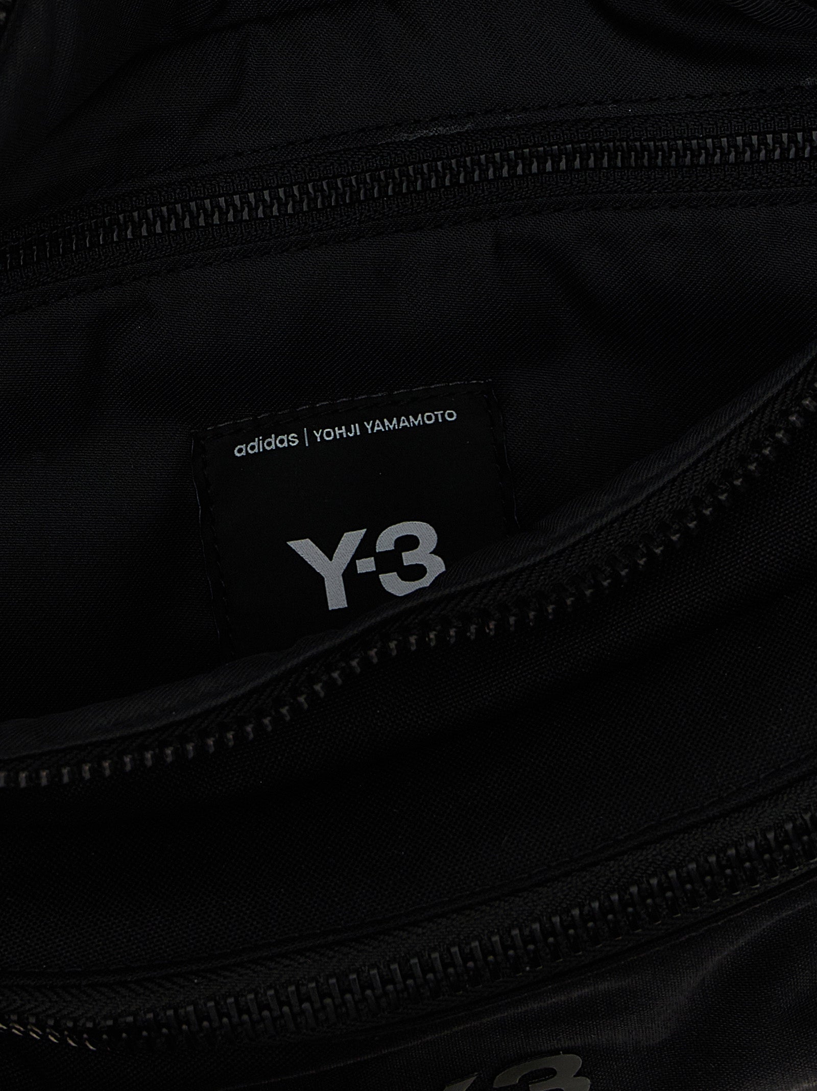Crossbody Fanny Pack Handbag by Y-3 for unisex in polyamide black features a transformative sophistication silhouette, showcasing a secure zipper, ample , and versatile crossbody-strap, shoulder-strap & adjustable-strap for a transformative sophistication look.