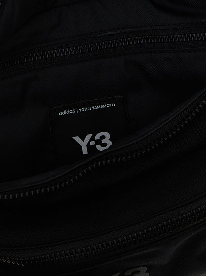 Crossbody Fanny Pack Handbag by Y-3 for unisex in polyamide black features a transformative sophistication silhouette, showcasing a secure zipper, ample , and versatile crossbody-strap, shoulder-strap & adjustable-strap for a transformative sophistication look.