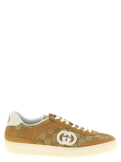 Sneakers by Gucci for women in bos taurus calfskin leather beige & signature presents a sumptuous silhouette, artfully capturing the essence of the Gg Women's Low Top Bos Taurus Calfskin Leather Sneakers with its sumptuous low-top style design.