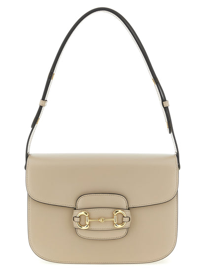Medium Shoulder Flap Bag by Gucci for women in calfskin leather beige & signature features a distinguished silhouette, showcasing a secure flap and distinguished with versatile shoulder-strap & adjustable-strap for a distinguished finish.