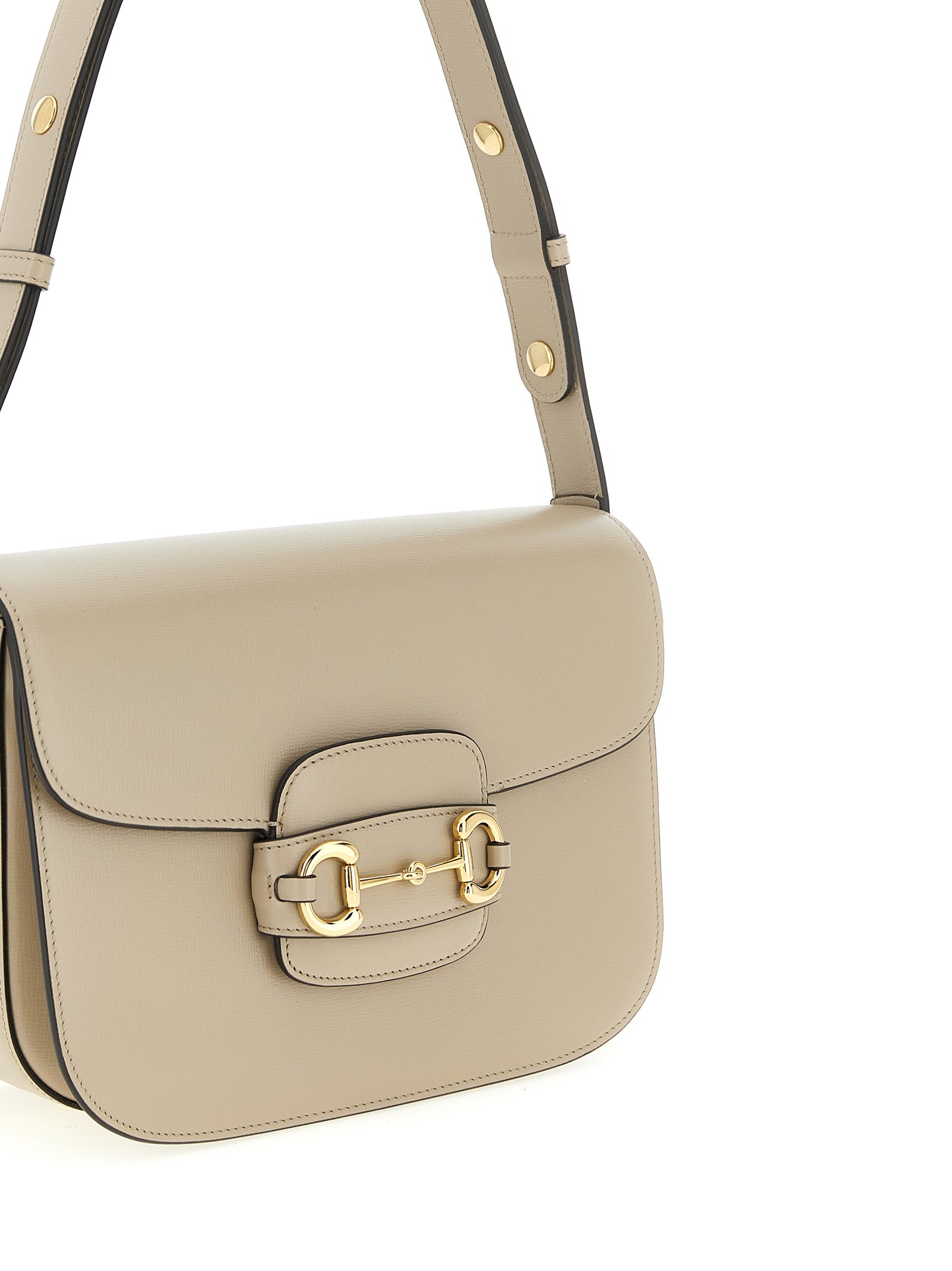 Medium Shoulder Flap Bag by Gucci for women in calfskin leather beige & signature features a enviable silhouette, showcasing a secure flap, ample , and enviable shoulder-strap & adjustable-strap for a enviable finish.