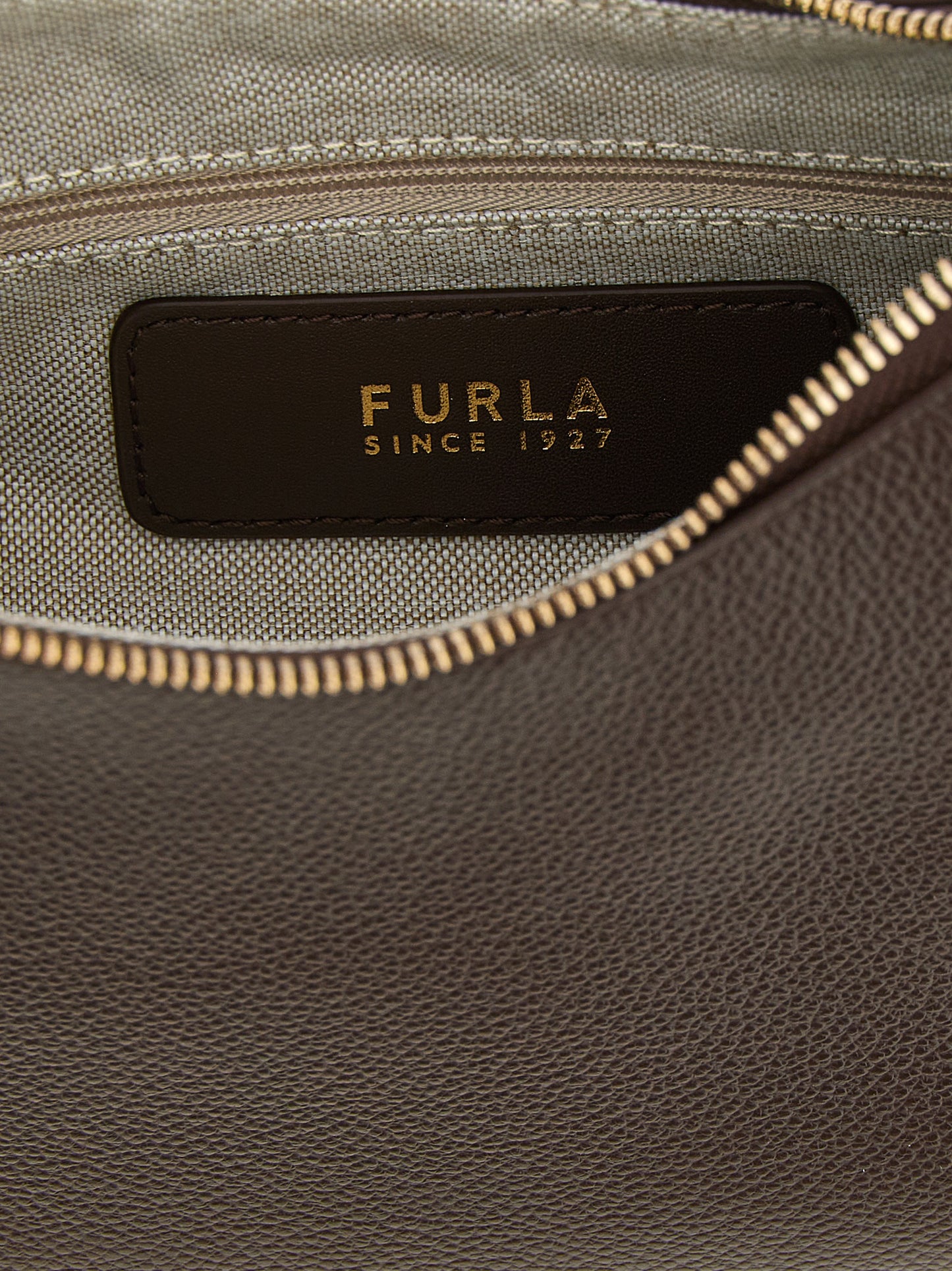 Shoulder Bag by Furla for women in calfskin leather brown showcases a enviable silhouette, artfully detailed with a secure zipper, organized , and versatile shoulder-strap, adjustable-strap & handle for a enviable look.