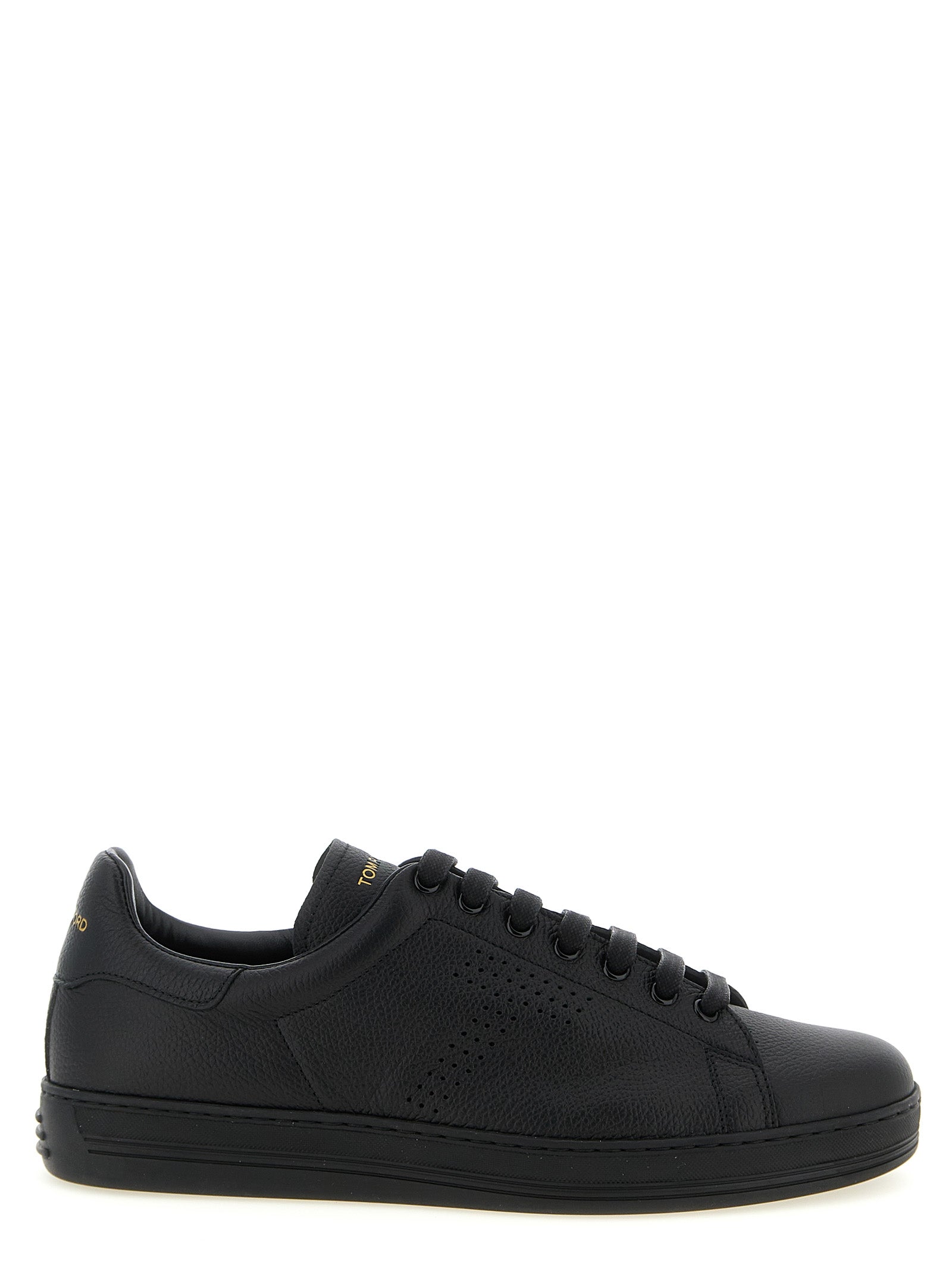 Sneakers by Tom Ford for men in leather & brass black presents a sumptuous silhouette, artfully capturing the essence of the Men's Low Top Leather & Brass Sneakers with its sumptuous low-top style design.