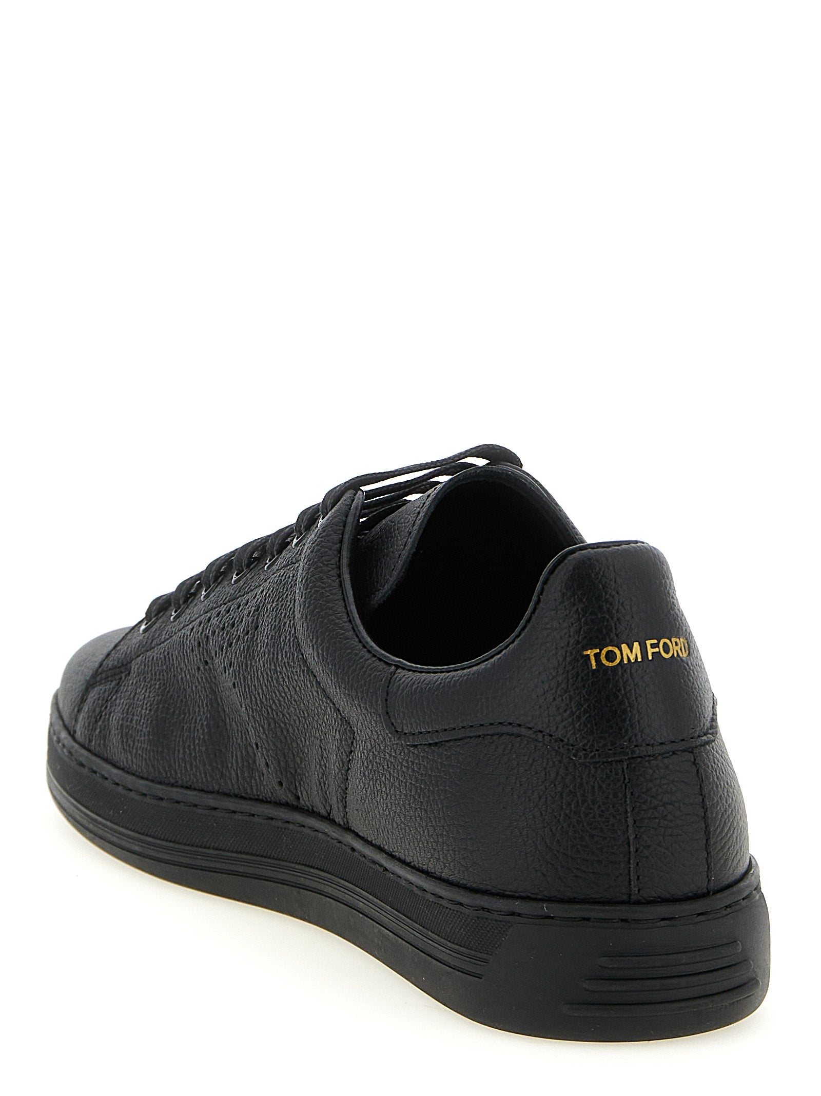 Sneakers by Tom Ford for men in leather & brass black presents a on trend silhouette from the Men's Low Top Leather & Brass Sneakers collection, showcasing a on trend low-top style for an elevated aesthetic.