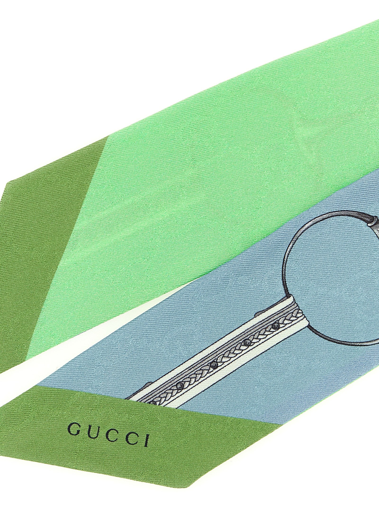 Scarf by Gucci for women in silk multicolor, jacquard & print showcases a warm silhouette from the Gg Ribbon Silk Scarf collection, offering a warm drape that exudes sophisticated luxury.