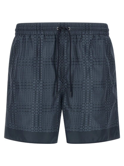 Swim Shorts from Gucci for men in polyester & mesh blue & print features an sleek silhouette, showcasing the distinct style of the Gg Men's Polyester & Mesh Swim Shorts collection.
