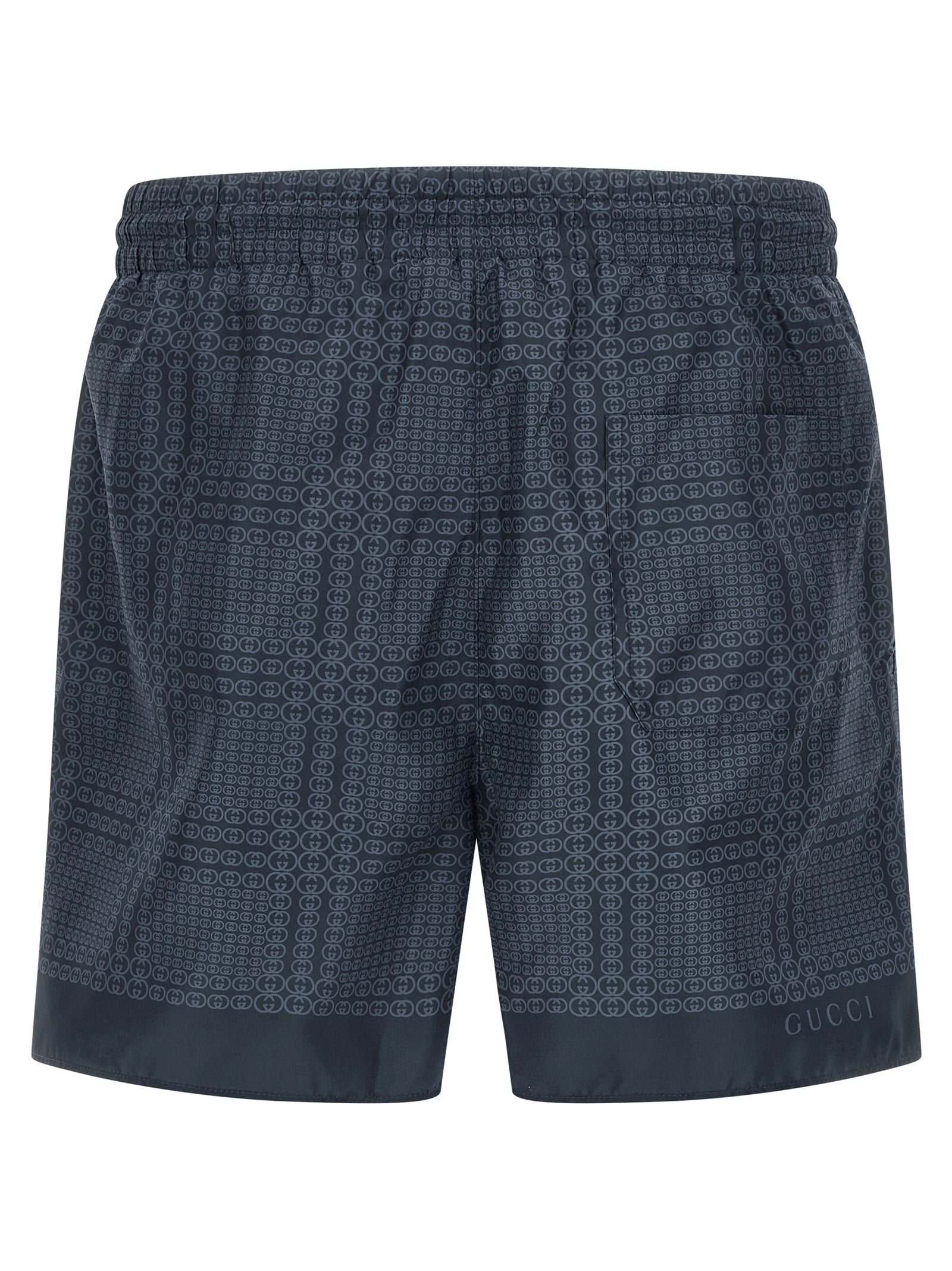 Swim Shorts by Gucci for men in polyester & mesh blue & print features a refined silhouette, showcasing the premium design of this Gg Men's Polyester & Mesh Swim Shorts.