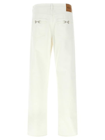 Jeans by Gucci for men in denim cotton canvas white presents a refined pantology silhouette, artfully defined by a refined pantology straight-leg & wide, long, and a sophisticated mid rise.