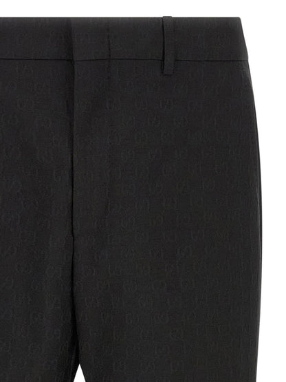 Trousers by Gucci for men in wool & polyester black & patterned features a artisanal silhouette, showcasing a sophisticated straight-leg & regular-fit with a long and for a artisanal finish.
