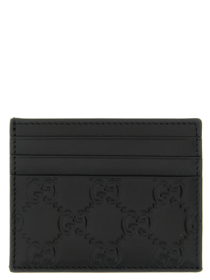 Cardholder Card Case by Gucci for men in calfskin leather black & patterned features a sleek silhouette, showcasing the sleek design of the Gg Calfskin Leather Cardholder Card Case with functional card-organization for a premium look.