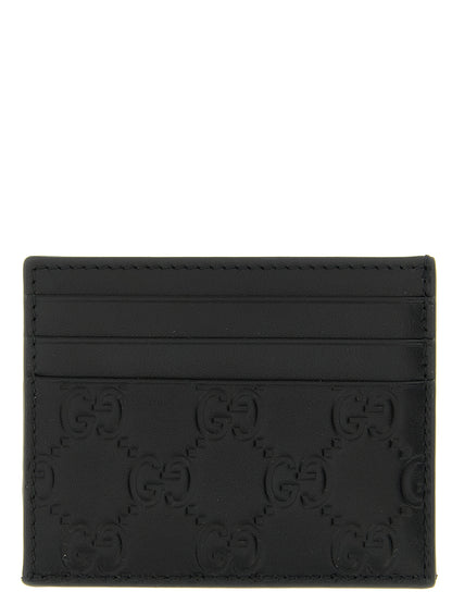 Cardholder Card Case by Gucci for men in calfskin leather black & patterned features a distinguished silhouette, showcasing the distinguished design of the Gg Calfskin Leather Cardholder Card Case with refined card-organization.