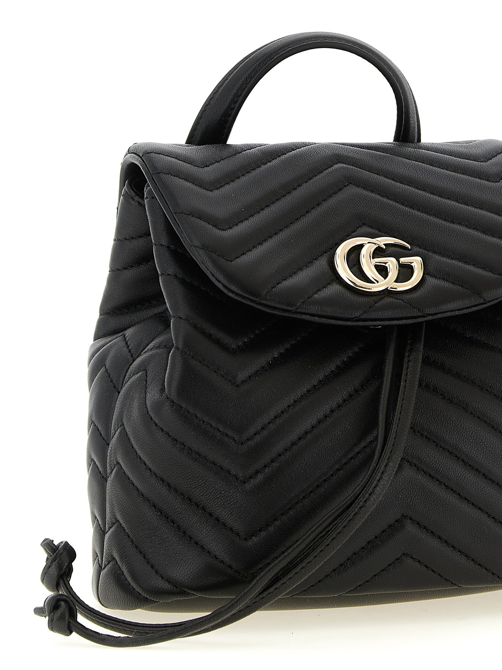 Medium Drawstring Backpack by Gucci for women in viscose & lamb leather black, patterned, chevron & signature features a effortlessly chic Gg Marmont Viscose & Lamb Leather Medium Drawstring Backpack design, showcasing a secure flap, drawstring & magnetic, ample , and versatile backpack-strap & adjustable-strap for a effortlessly chic finish.