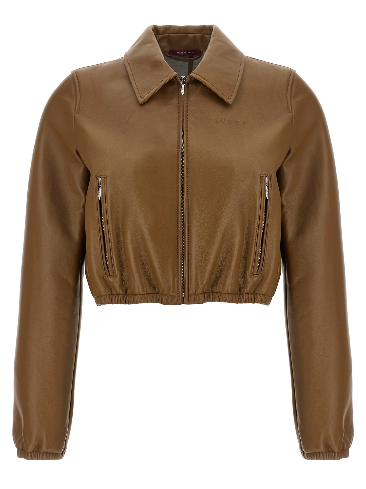 This Jacket by Gucci for women in lamb leather beige showcases a magnificent silhouette, meticulously crafted with a distinctive and functional pockets for a magnificent finish.