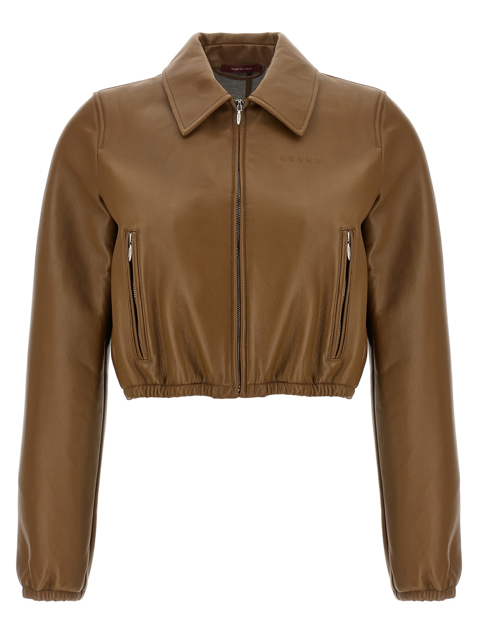 This Jacket by Gucci for women in lamb leather beige showcases a magnificent silhouette, meticulously crafted with a distinctive and functional pockets for a magnificent finish.