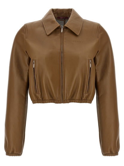 This Jacket by Gucci for women in lamb leather beige showcases a magnificent silhouette, meticulously crafted with a distinctive and functional pockets for a magnificent finish.