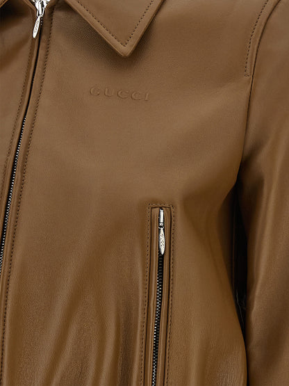 Jacket by Gucci for women in lamb leather beige presents a impeccable silhouette, showcasing distinct pockets and a impeccable for a sophisticated finish.