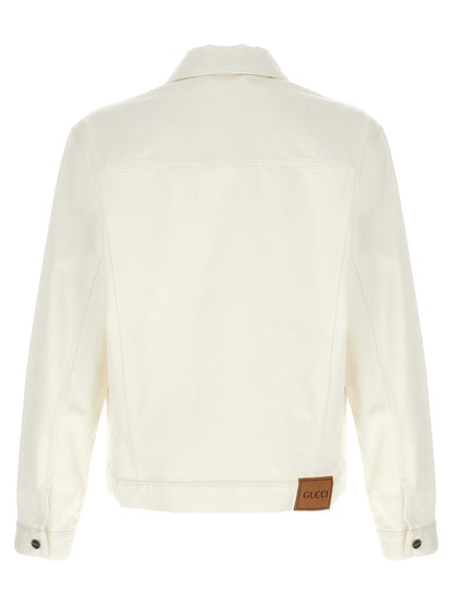 Trucker Jacket by Gucci for men in denim cotton white features a city-ready silhouette, detailed with pockets and a city-ready shirt-collar neckline.