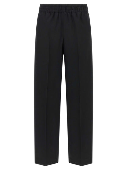 Trousers by Golden Goose for women in virgin wool black presents a smart silhouette, meticulously detailed with a smart straight-leg, a smart long, and a smart .