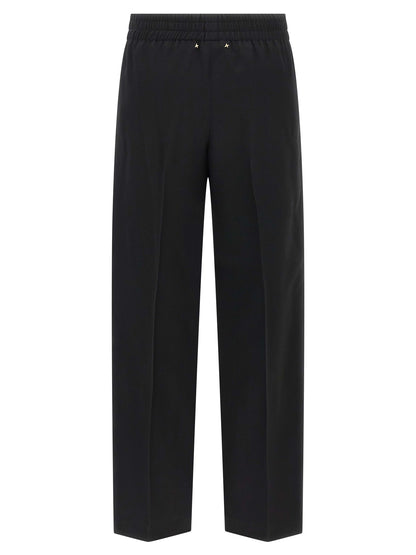 Trousers by Golden Goose for women in virgin wool black features a artisanal silhouette, showcasing a sophisticated straight-leg with a long and for a artisanal finish.