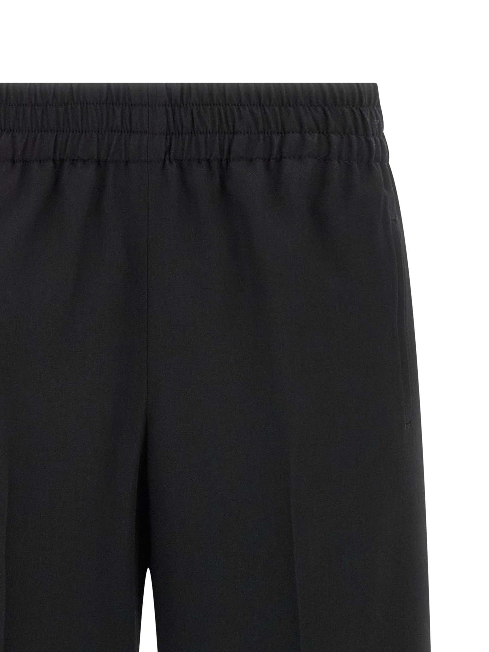 Trousers by Golden Goose for women in virgin wool black features an sartorial silhouette, showcasing a precise straight-leg and long with a sartorial for a refined look.