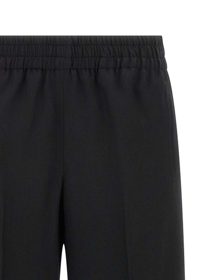Trousers by Golden Goose for women in virgin wool black features an sartorial silhouette, showcasing a precise straight-leg and long with a sartorial for a refined look.