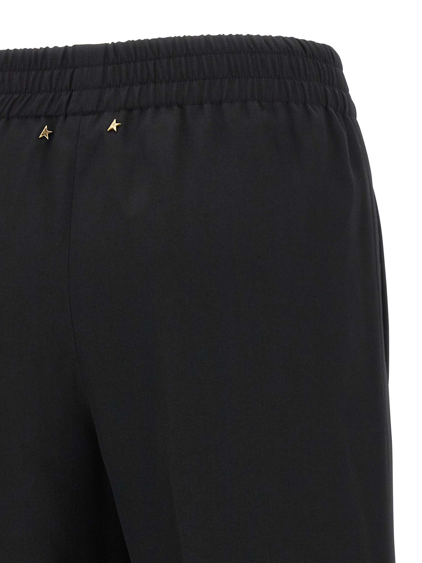 Trousers by Golden Goose for women in virgin wool black presents a perennial silhouette, meticulously tailored with a straight-leg cut, long finish, and an elegant .