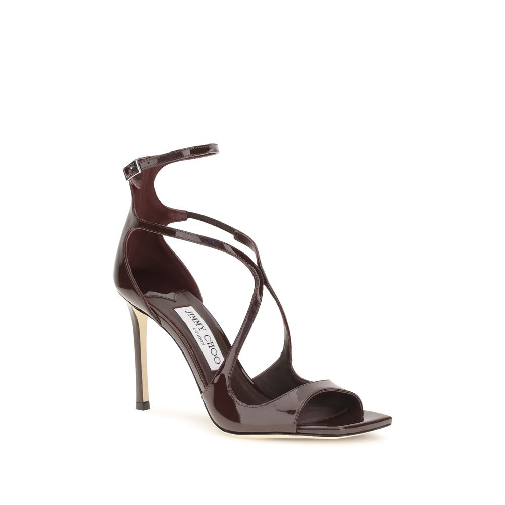 Stiletto Ankle Strap Sandals by Jimmy Choo for women in bos taurus calf patent leather brown features an architectural design from the Women's Bos Taurus Calf Patent Leather Stiletto Ankle Strap Sandals collection, defined by a architectural stiletto and open toe style for a architectural finish.
