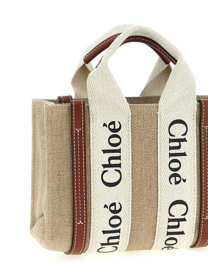 Mini Shoulder Tote Handbag by Chloé for women in canvas & calfskin leather multicolor features a contemporary silhouette, showcasing a secure , ample , and contemporary shoulder-strap & handle for a sophisticated look.