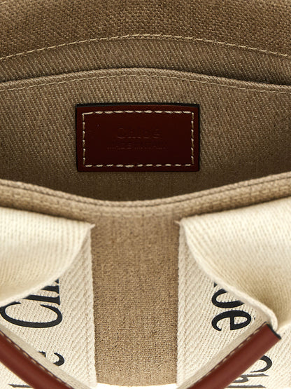 Mini Shoulder Tote Handbag by Chloé for women in canvas & calfskin leather multicolor features a refined silhouette, showcasing a secure , organized , and versatile shoulder-strap & handle for a refined finish.