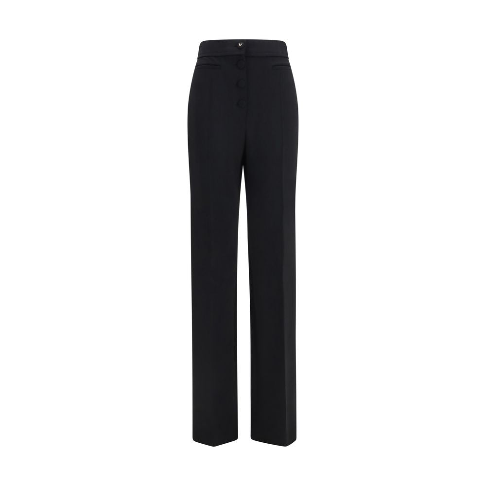 Trousers by Valentino Garavani for women in wool black presents a perennial silhouette, meticulously tailored with a flared & regular-fit cut, long finish, and an elegant .
