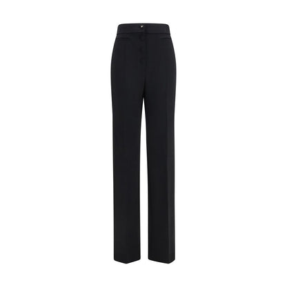 Trousers by Valentino Garavani for women in wool black presents a perennial silhouette, meticulously tailored with a flared & regular-fit cut, long finish, and an elegant .