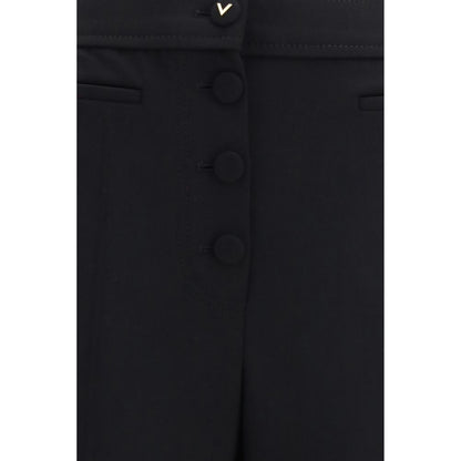 Trousers by Valentino Garavani for women in wool black features a sculptural silhouette, showcasing a sculptural flared & regular-fit and long with a sophisticated for a sculptural finish.