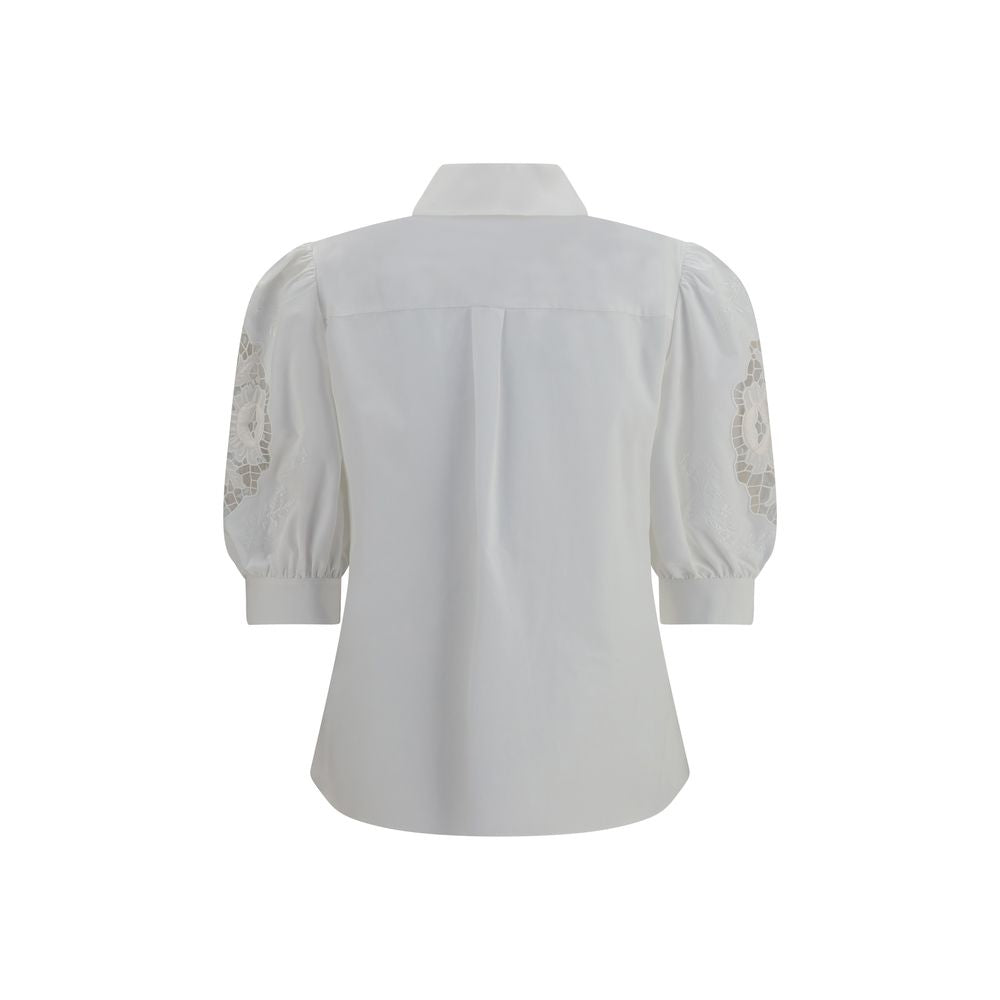Blouse by Valentino Garavani for women in cotton white showcases a sublime silhouette, artfully detailed with a sublime and for a sophisticated, sublime finish.