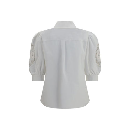 Blouse by Valentino Garavani for women in cotton white showcases a sublime silhouette, artfully detailed with a sublime and for a sophisticated, sublime finish.