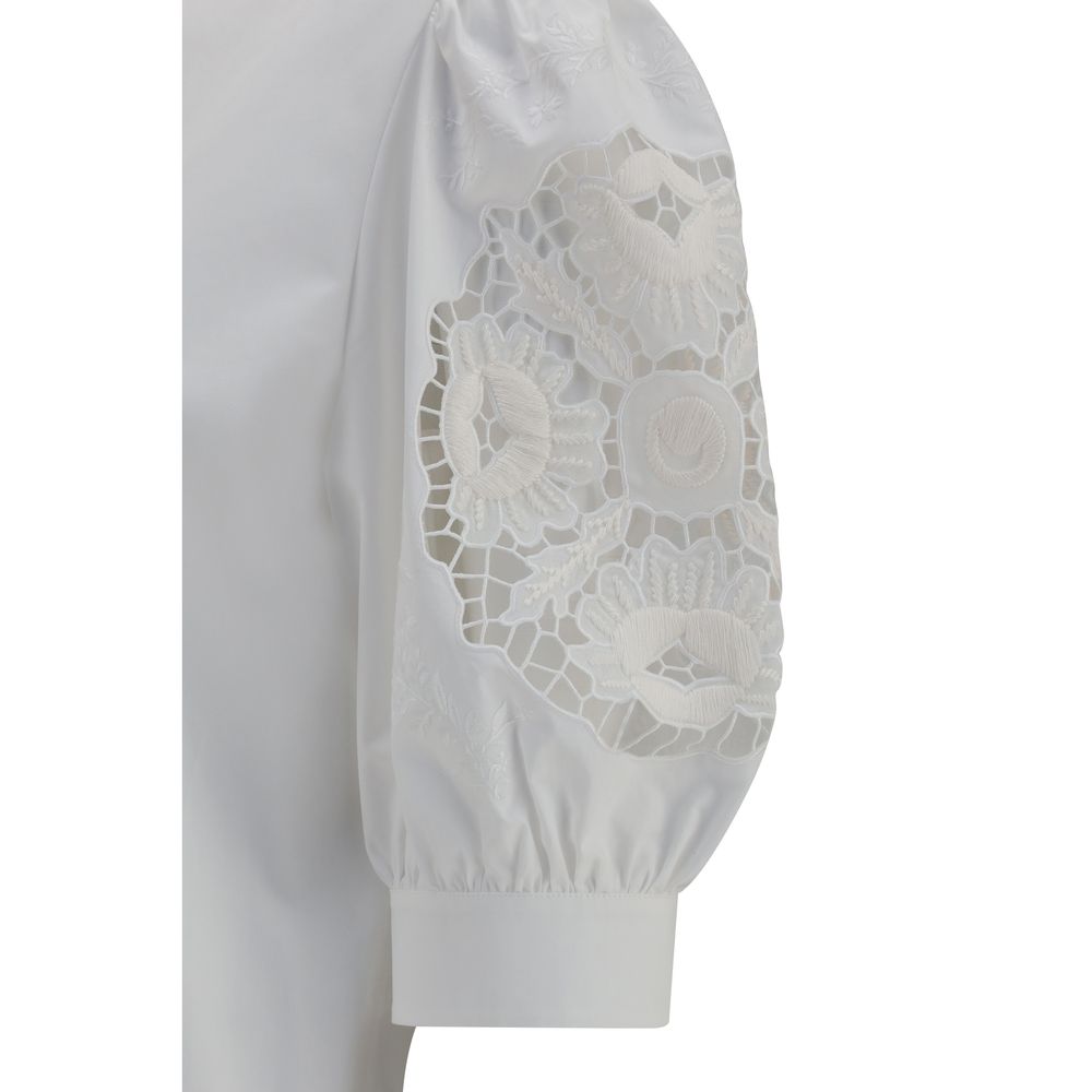 Blouse by Valentino Garavani for women in cotton white showcases a sharp silhouette, elegantly detailed with a sharp and sharp .
