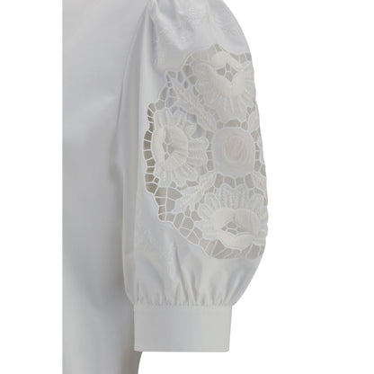 Blouse by Valentino Garavani for women in cotton white showcases a sharp silhouette, elegantly detailed with a sharp and sharp .