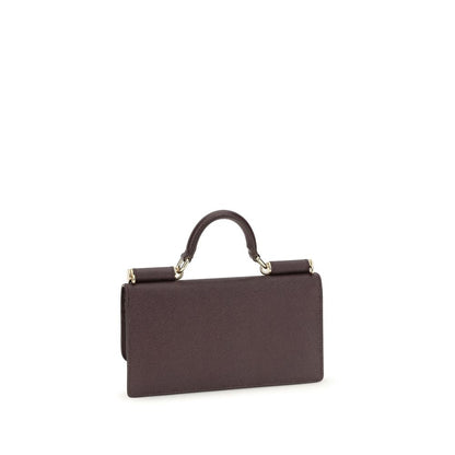 Micro Shoulder Flap Bag by Dolce & Gabbana for women in bos taurus calf leather brown & signature presents a versatile silhouette, showcasing a secure flap, magnetic & button and versatile with versatile shoulder-strap & handle for a sophisticated look.
