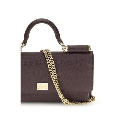 Micro Shoulder Flap Bag by Dolce & Gabbana for women in bos taurus calf leather brown & signature showcases a enviable silhouette, artfully detailed with a secure flap, magnetic & button, organized , and versatile shoulder-strap & handle for a enviable look.